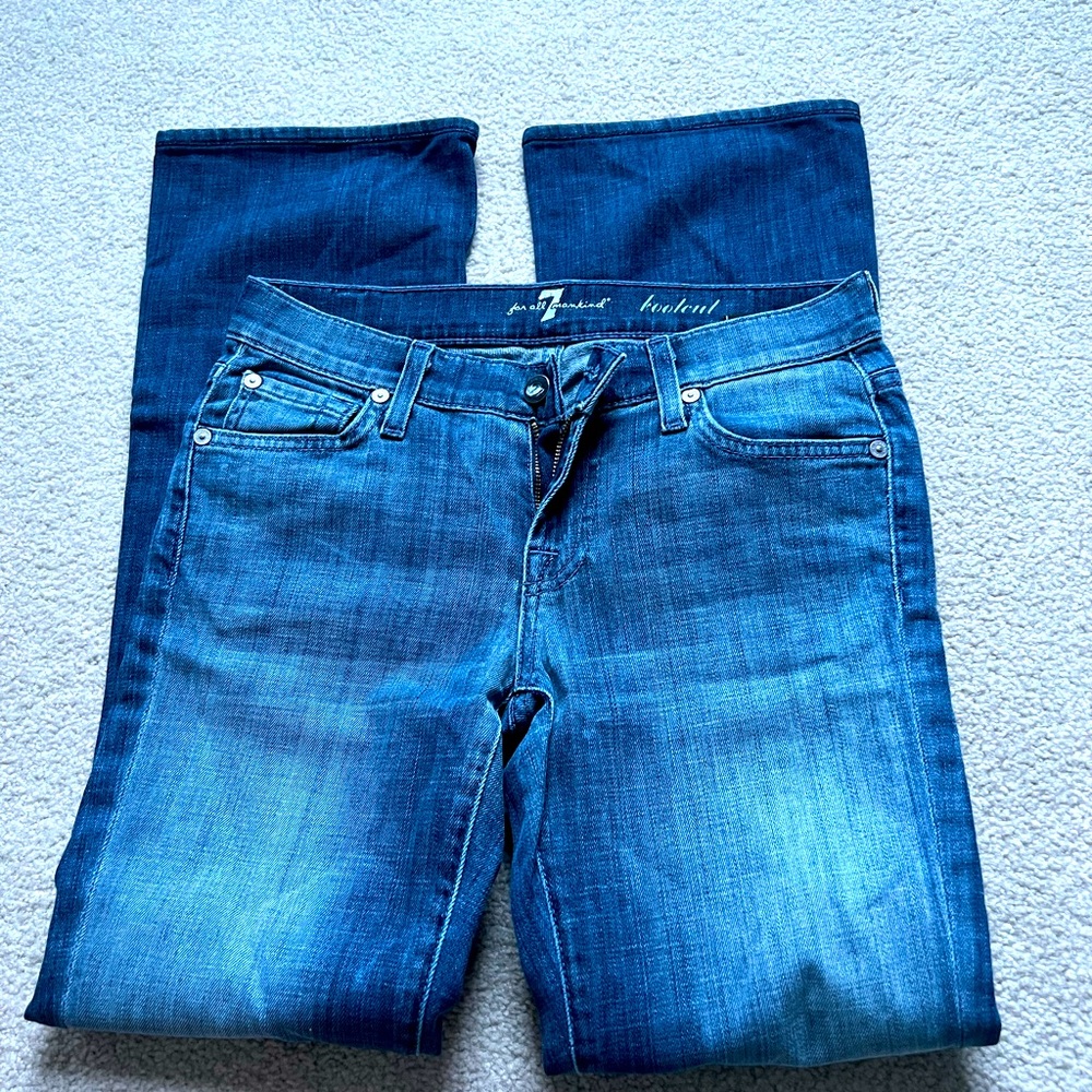 7 for the mankind jeans. Buttons in back pockets. Low rise bootcut. Size 25.